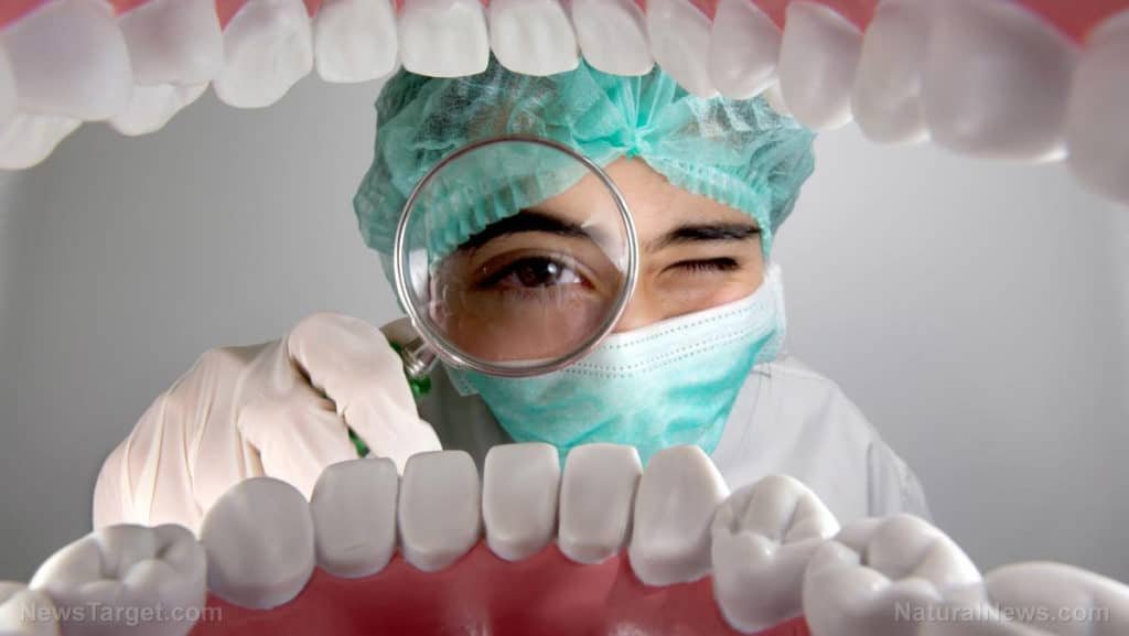 dentist checking patient's teeth