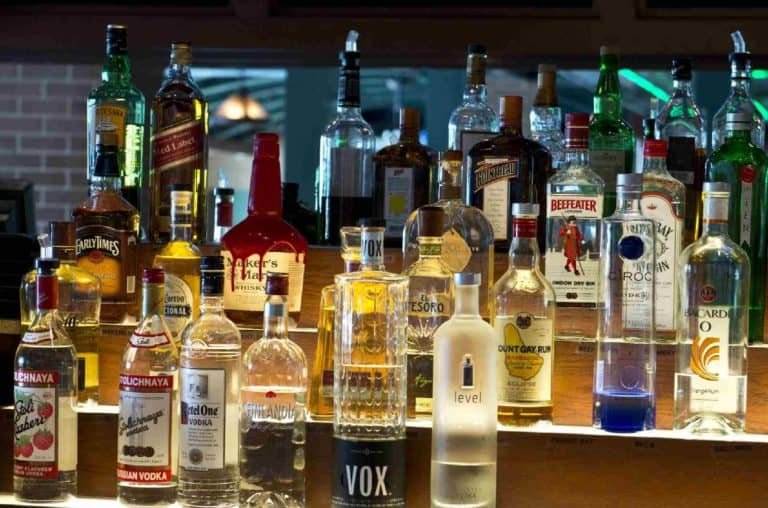 A bar filled with bottles of alcoholic drinks