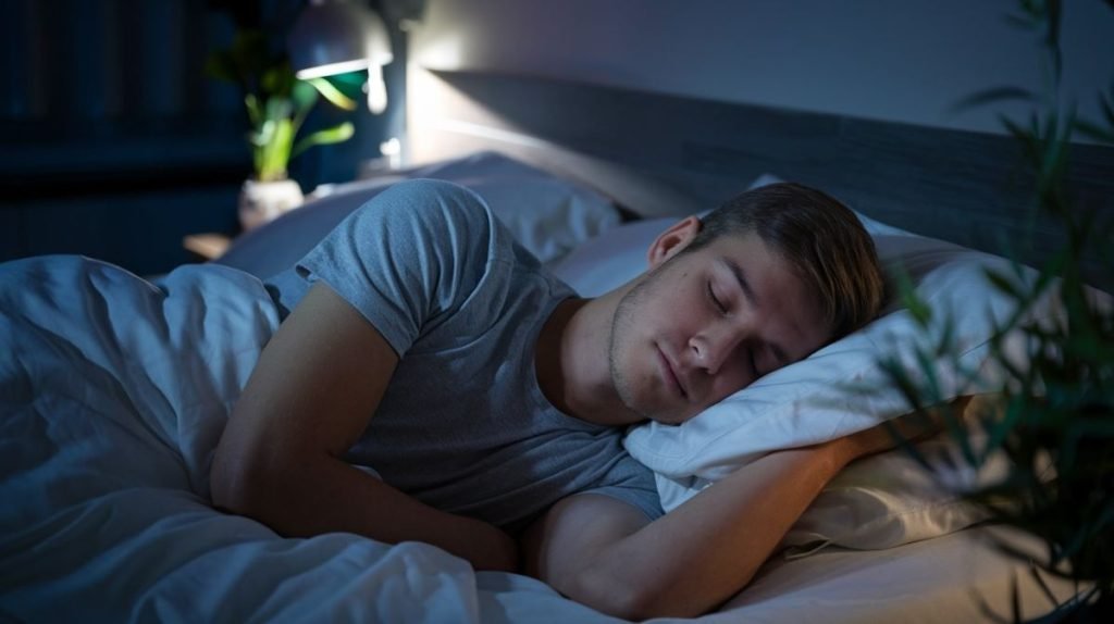 A man is sleeping peacefully on his bed