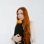 A red haired woman with very long hair
