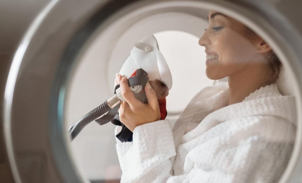 A Happy woman in a hyperbaric oxygen therapy chamber