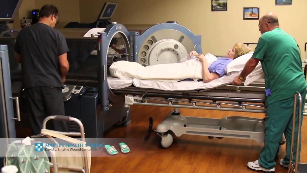 A patient is being admissioned in a hyperbaric oxygen chamber