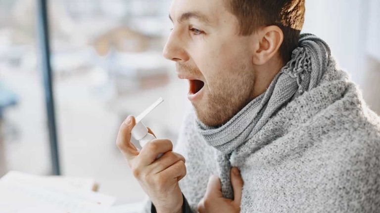 Man Taking Medication for Throat