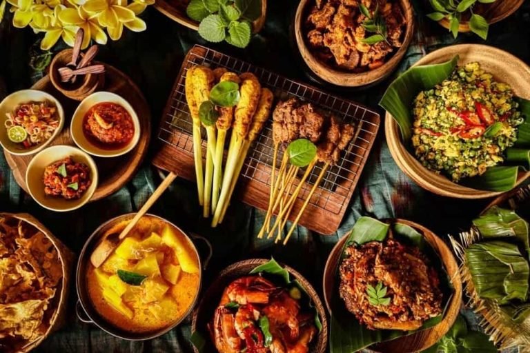 A typical assortment of dishes included in a rijsttafel.