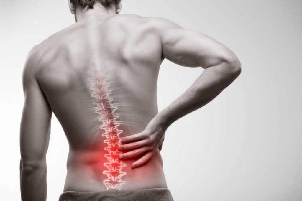 A man with back pain highlighting in red its pain