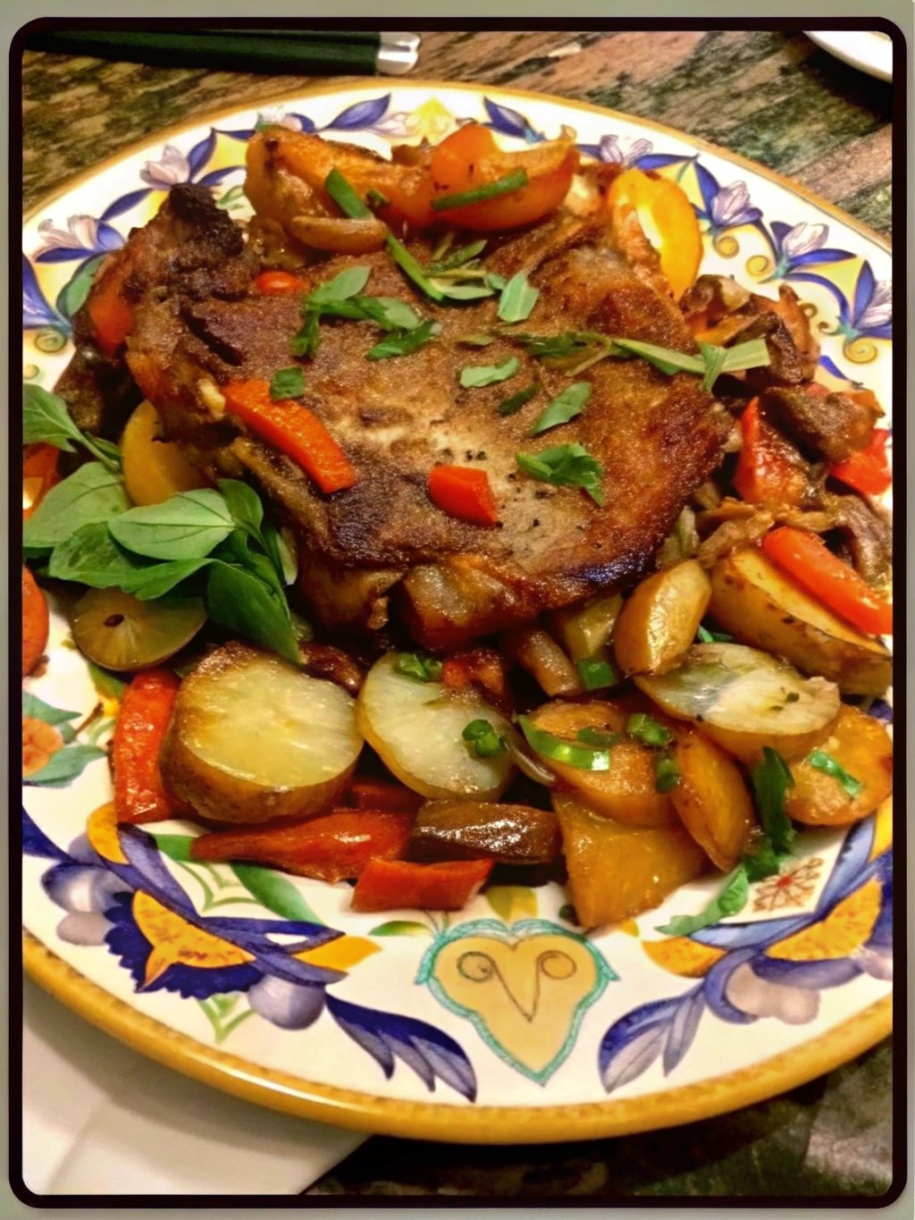 Pork Chops with vinegar peppers and potatoes.