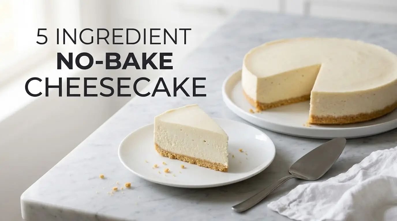 Whole no-bake cheesecake with one clean slice plated beside it, made with 5 ingredients